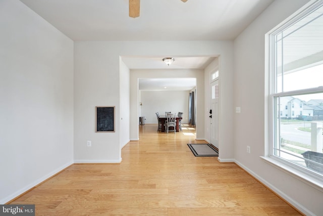 entryway featuring light wood-type flooring and baseboards