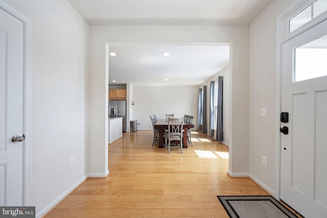 entrance foyer featuring recessed lighting, baseboards, and light wood finished floors