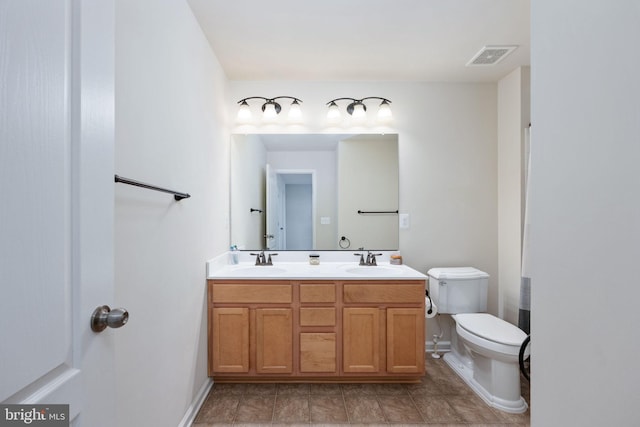 full bathroom with double vanity, visible vents, toilet, and a sink