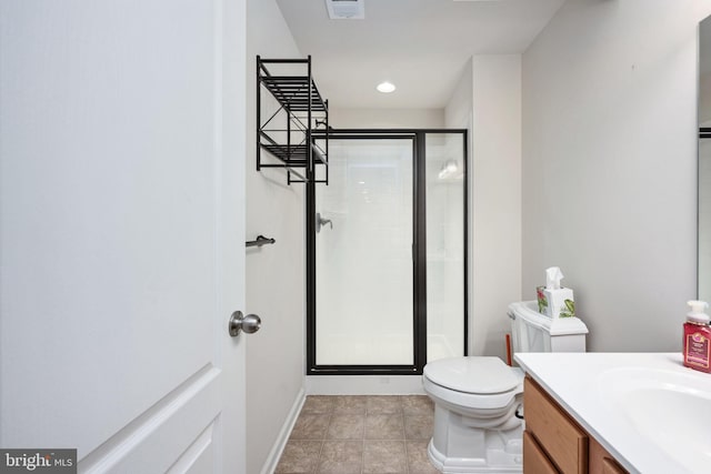 bathroom with toilet, visible vents, vanity, baseboards, and a shower stall