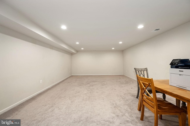 office space featuring recessed lighting, light colored carpet, visible vents, and baseboards