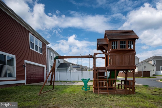 view of play area with a yard and fence