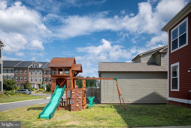 view of play area featuring a lawn