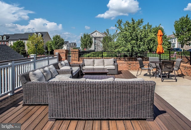 wooden deck featuring a residential view, outdoor dining area, outdoor lounge area, and a patio area