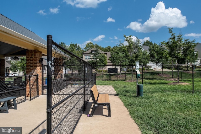 surrounding community featuring a yard and fence