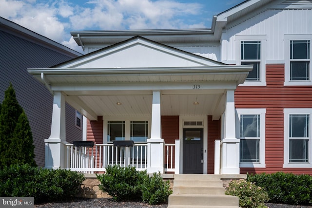 entrance to property with a porch