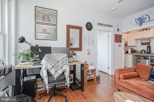 office area with light hardwood / wood-style flooring