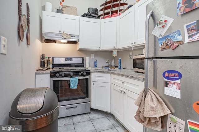 kitchen with stainless steel appliances, sink, and white cabinets