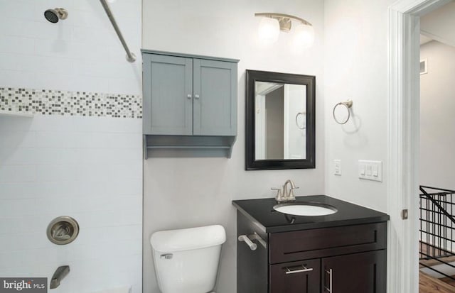 bathroom featuring hardwood / wood-style floors, vanity, and toilet