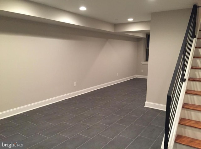 basement featuring dark tile patterned floors