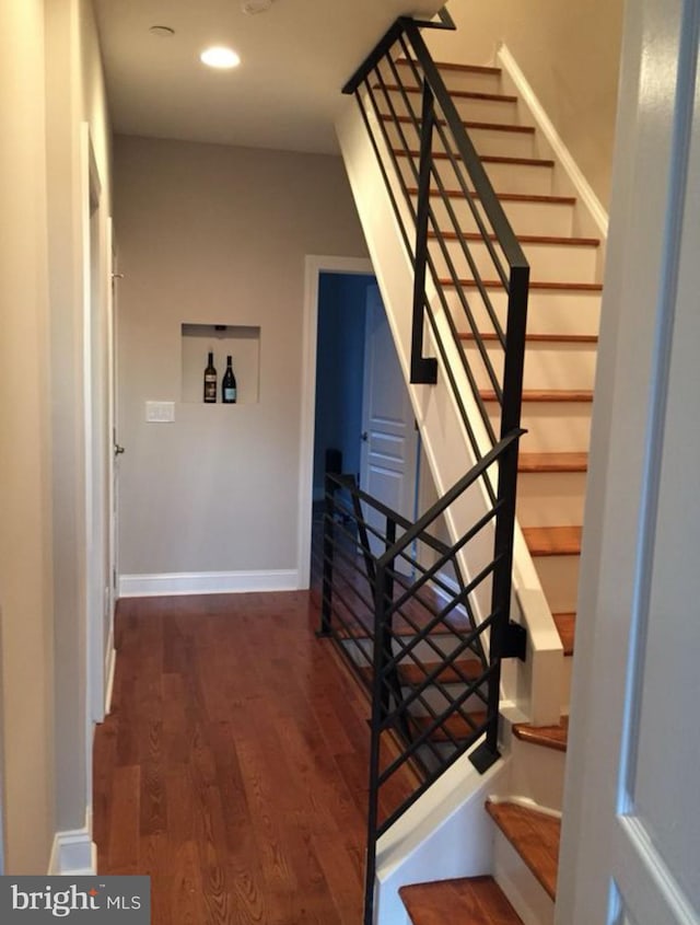 stairs with wood-type flooring