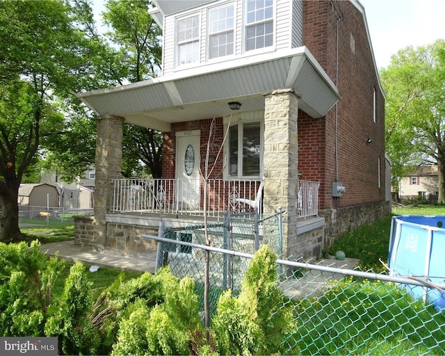 view of front of property featuring covered porch