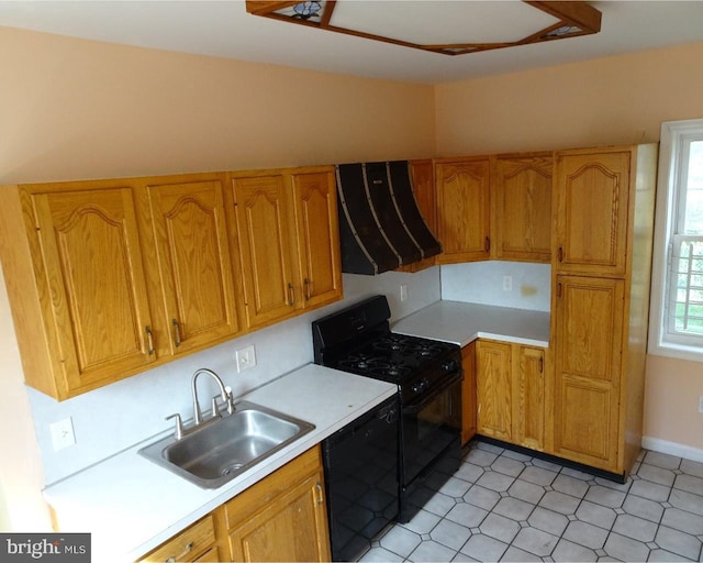 kitchen featuring sink, black appliances, and ventilation hood