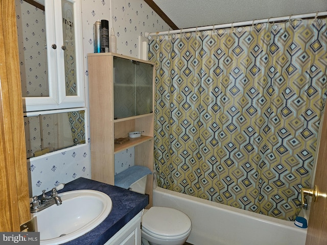 full bathroom featuring a textured ceiling, vanity, toilet, and shower / tub combo