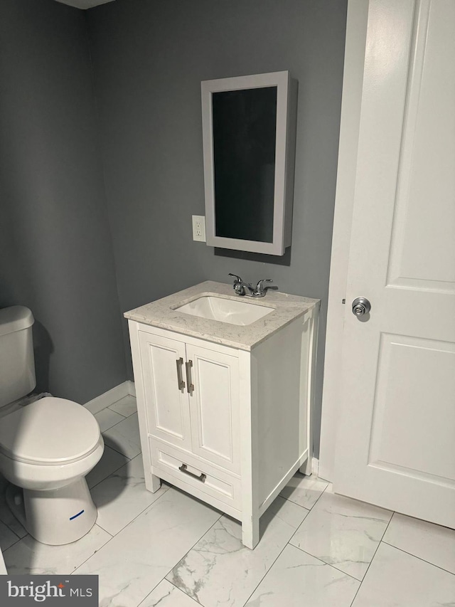 bathroom with vanity and toilet