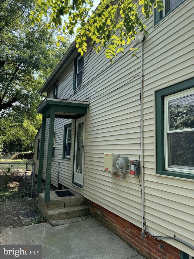 view of home's exterior with fence