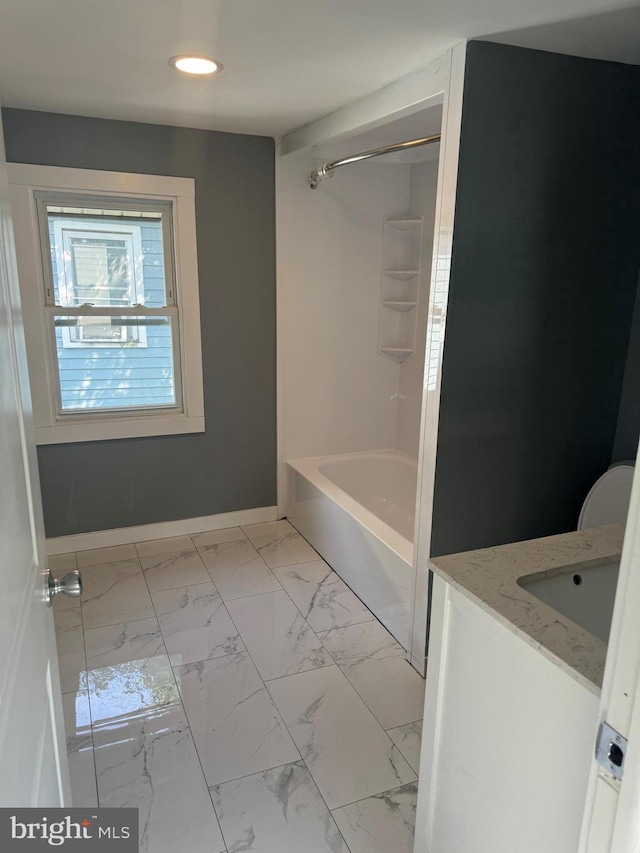 bathroom featuring vanity and bathing tub / shower combination