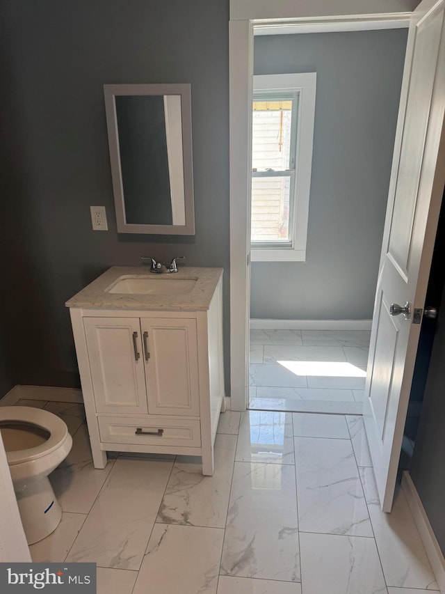 bathroom with vanity and toilet