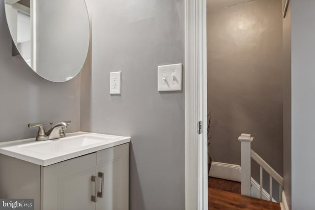 bathroom featuring vanity and hardwood / wood-style flooring