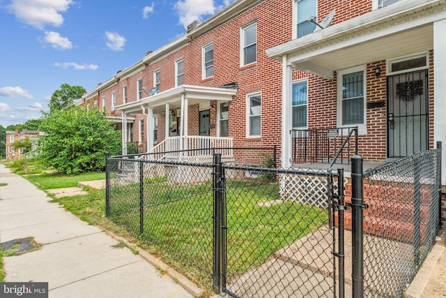 3220 Elmley Ave, Baltimore, MD 21213 - exterior space featuring a lawn and a porch