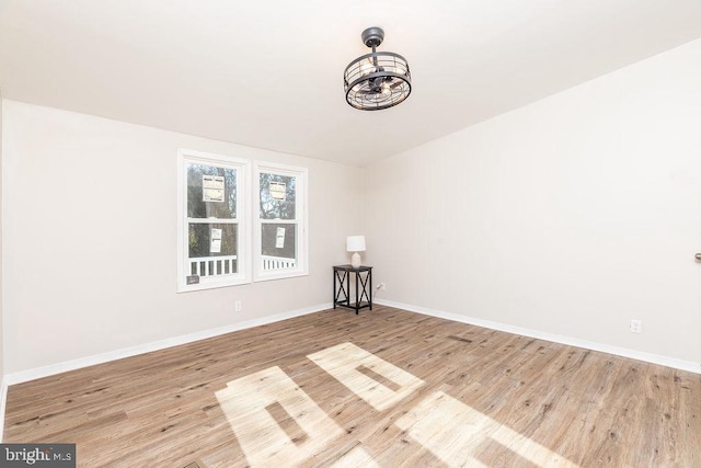 spare room with light hardwood / wood-style flooring