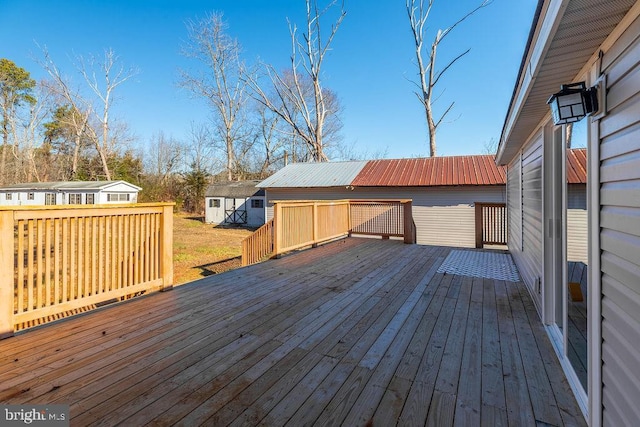 wooden terrace with a shed