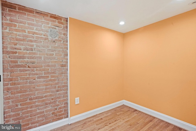 empty room with wood-type flooring