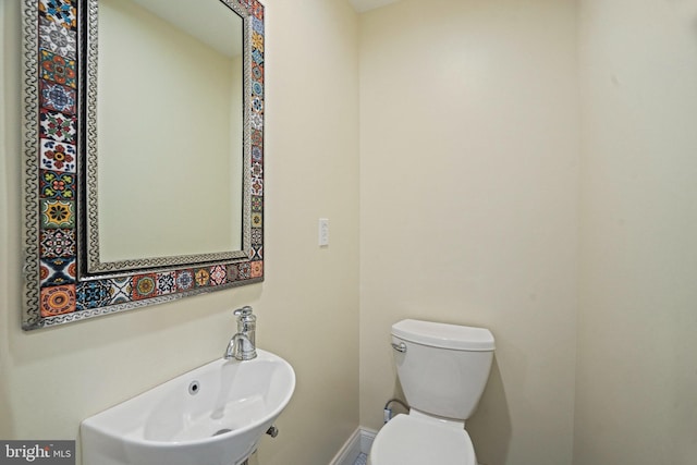 bathroom with sink and toilet