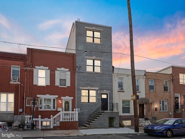 townhome / multi-family property with brick siding