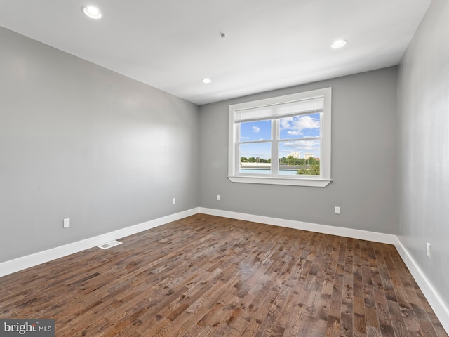 empty room with wood-type flooring