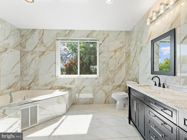 bathroom featuring tile walls, toilet, a washtub, and vanity