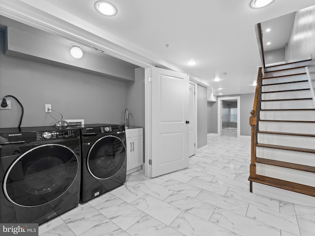 washroom featuring baseboards, independent washer and dryer, recessed lighting, cabinet space, and marble finish floor