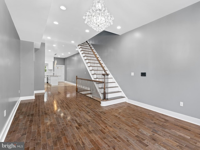 interior space with hardwood / wood-style flooring and a notable chandelier