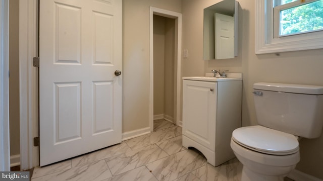 bathroom featuring toilet and vanity