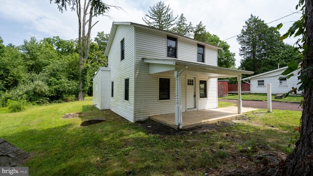 view of front of house with central air condition unit and a front lawn