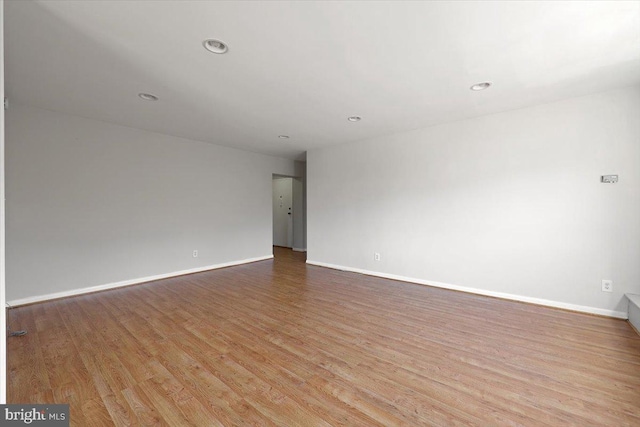 unfurnished room featuring light wood-type flooring