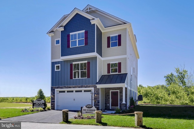 view of front facade with a garage and a front lawn