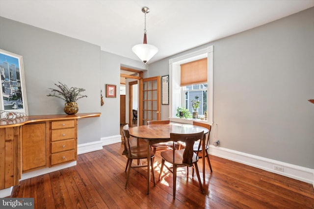 dining area with dark hardwood / wood-style floors