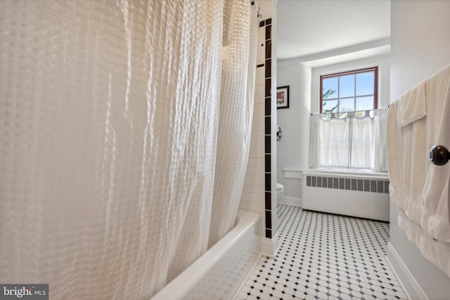 bathroom with tile patterned flooring, shower / bath combination with curtain, toilet, and radiator heating unit