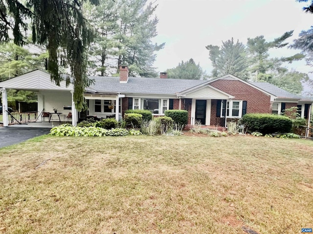 single story home with a carport and a front lawn