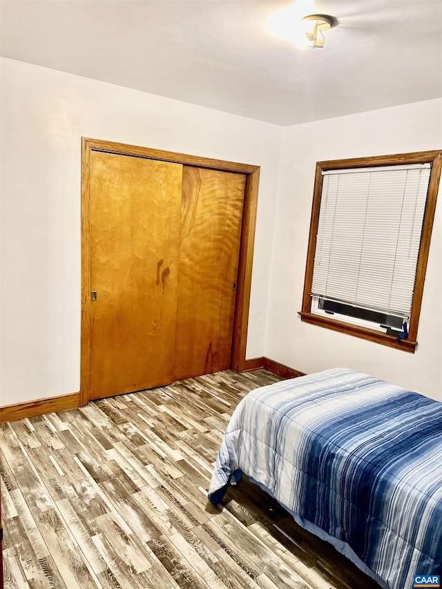 bedroom featuring a closet and hardwood / wood-style floors