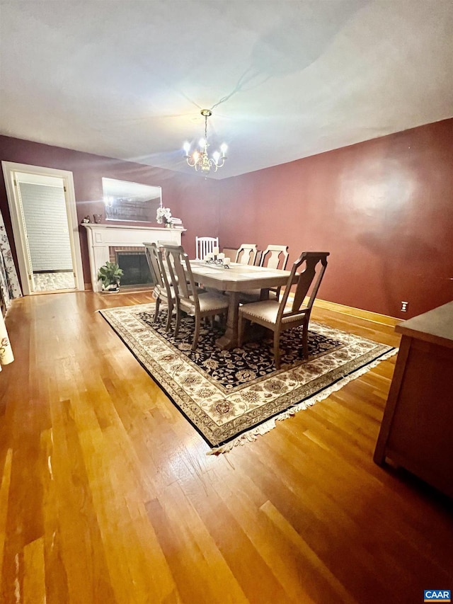 dining space featuring a chandelier and light hardwood / wood-style floors