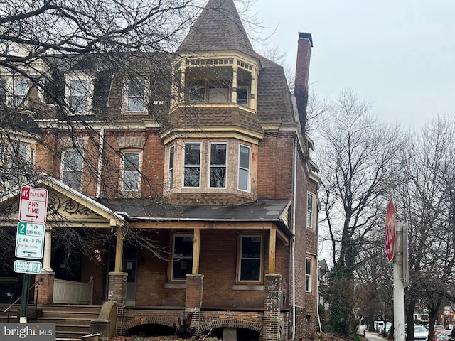 victorian home featuring a porch