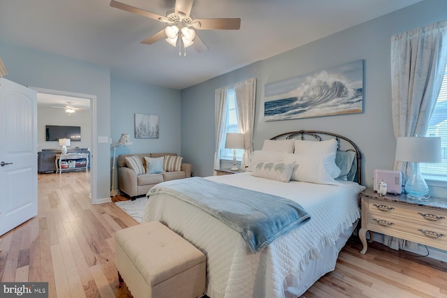 bedroom with light carpet and ceiling fan