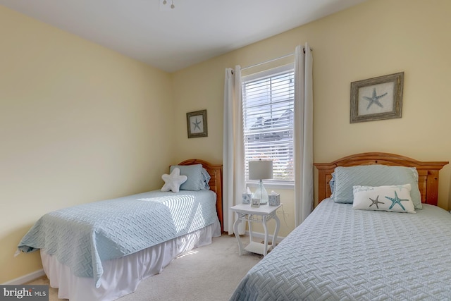 bedroom featuring light colored carpet