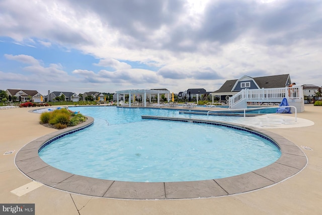 view of swimming pool featuring a patio area