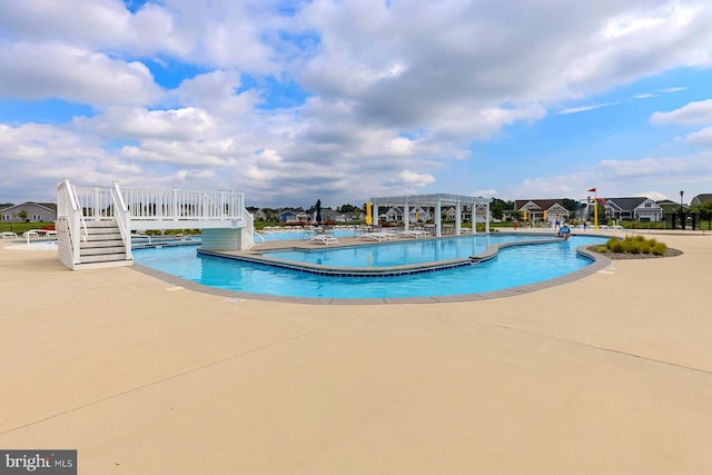 view of pool featuring a patio