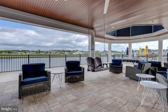 dock area featuring a deck with water view