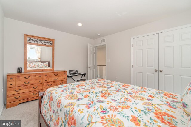 bedroom featuring a closet and carpet floors