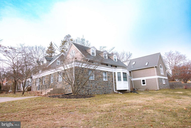 view of property exterior with a yard